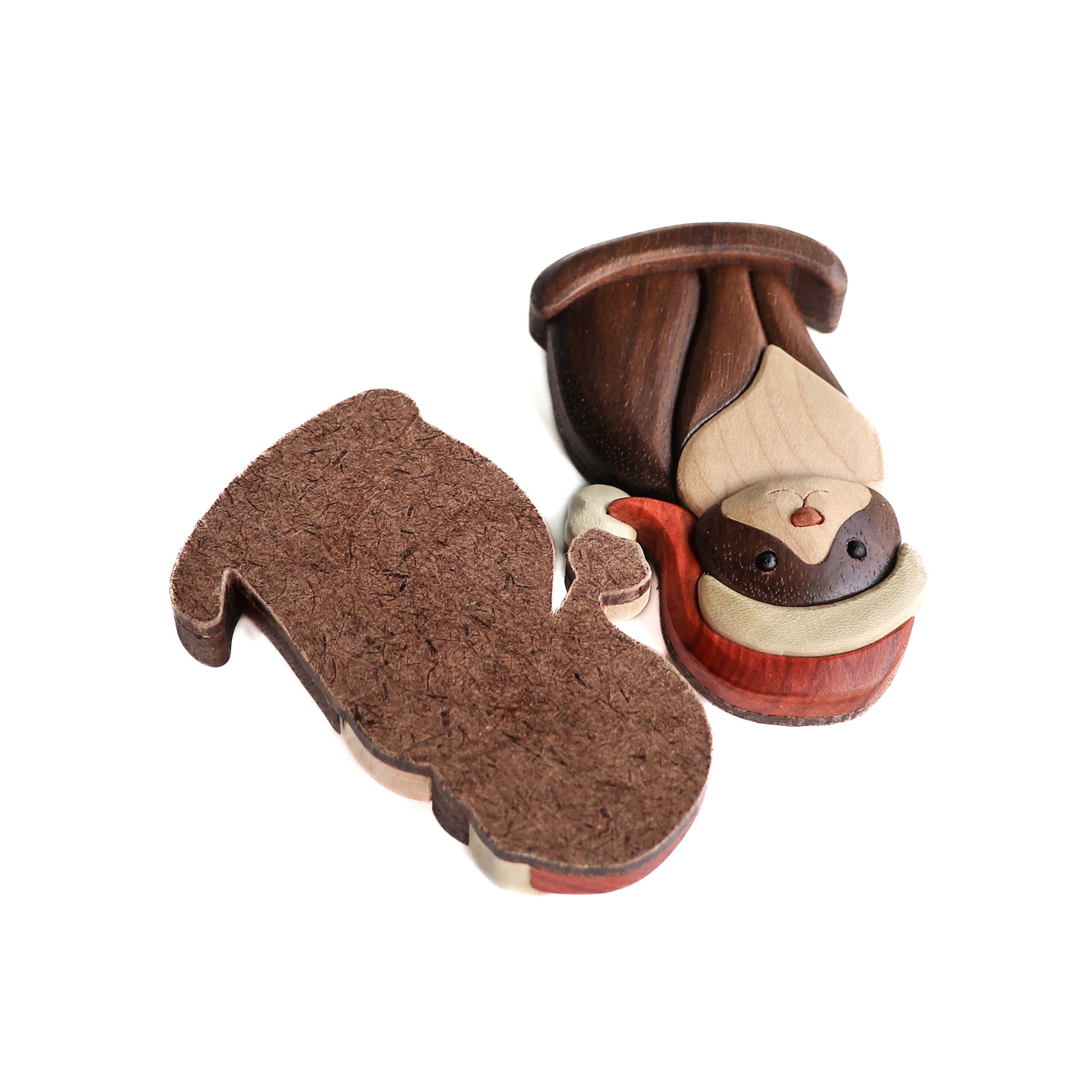 Christmas version of a tuxedo cat wood intarsia wearing a santa hat made out of redheart and holly and the body made out of peruvian walnut and maple and the back side made from hardboard ready to drill a magnet or ornament for decoration.