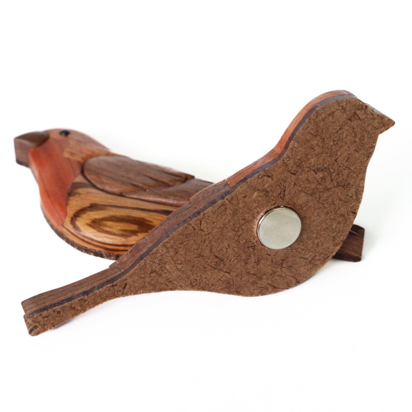 A focus of a housefinch wood intarsia with neodymium magnet inserted into the backing material of the intarsia made from hardboard.